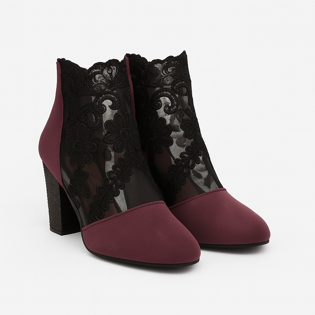 Heeled ankle boots with black embroidered lace panels and block heels.
