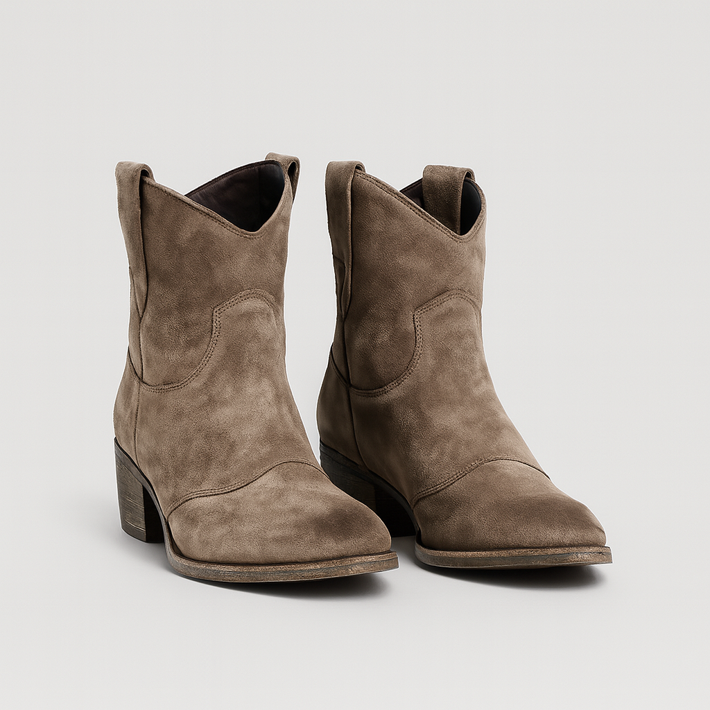 Suede Western-style ankle boots with curved topline and gently distressed soles.