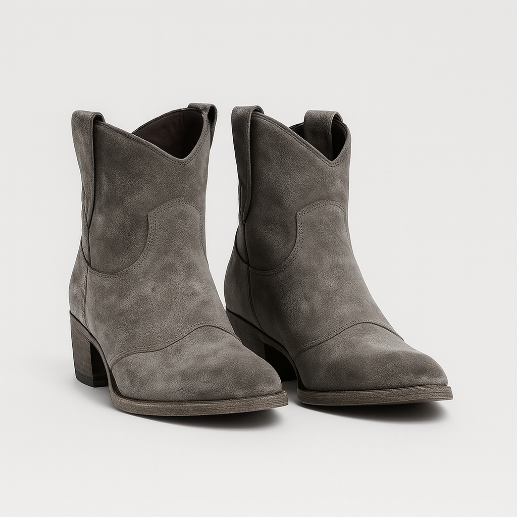 Suede Western-style ankle boots with curved topline and gently distressed soles.